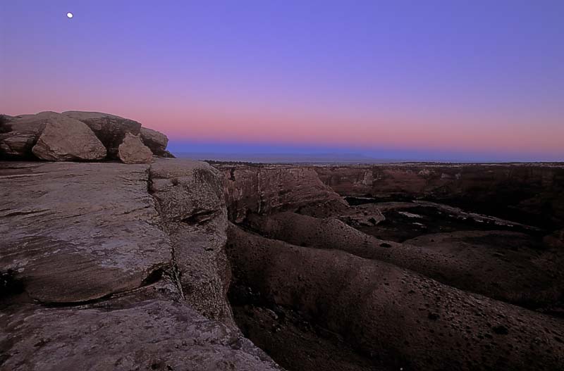 Sunrise Glow.  Alpin glow on the horizon.  Canyon de Chelley.  F100, 17-35mm, Velvia