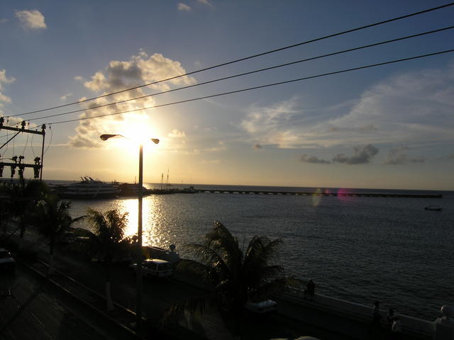 sun setting over punta lagusta pier.